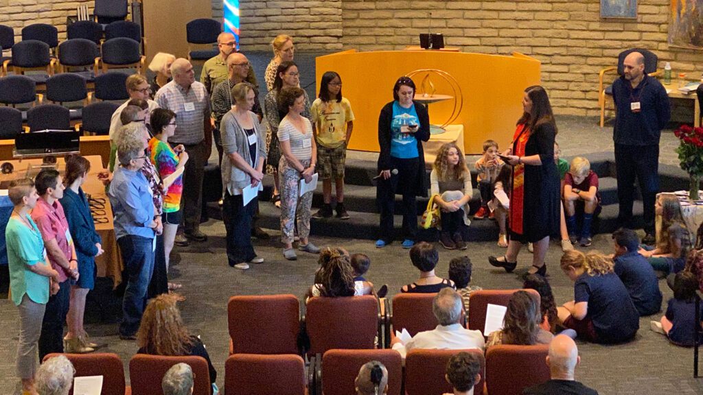 Rev Christine Dance in sanctuary with new members during new member service
