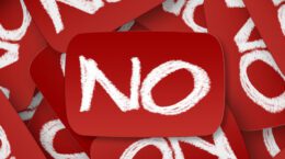 Red cards with "NO" written in white chalk