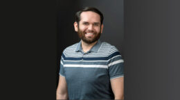 A pic of our new intern Isaac Castro with a muted gradient background