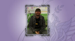 A picture of Chris King squatting outdoors, with a purple gradient background and our phoenix logo