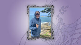 Vincent Waldron with an ocean cliff behind him inside a picture frame
